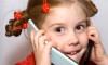 Little girl talking on two mobile phones