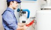 Plumber repairing an hot-water heater